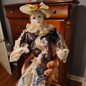 Elegant Porcelain Doll with Gold and Blue Accents
